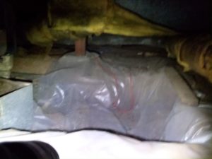 picture of rectangular dugout where old oil burning furnace would go in crawlspace